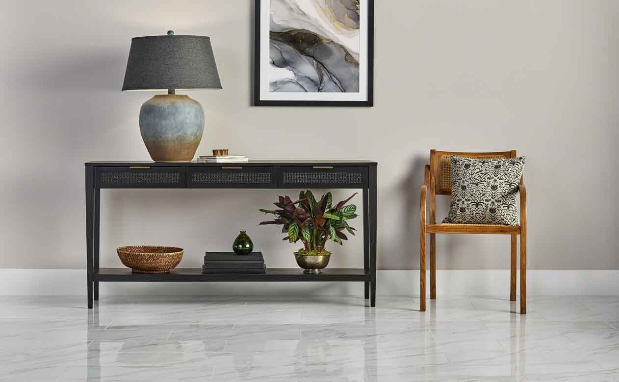 Marbled tile entryway with black and brown tones 